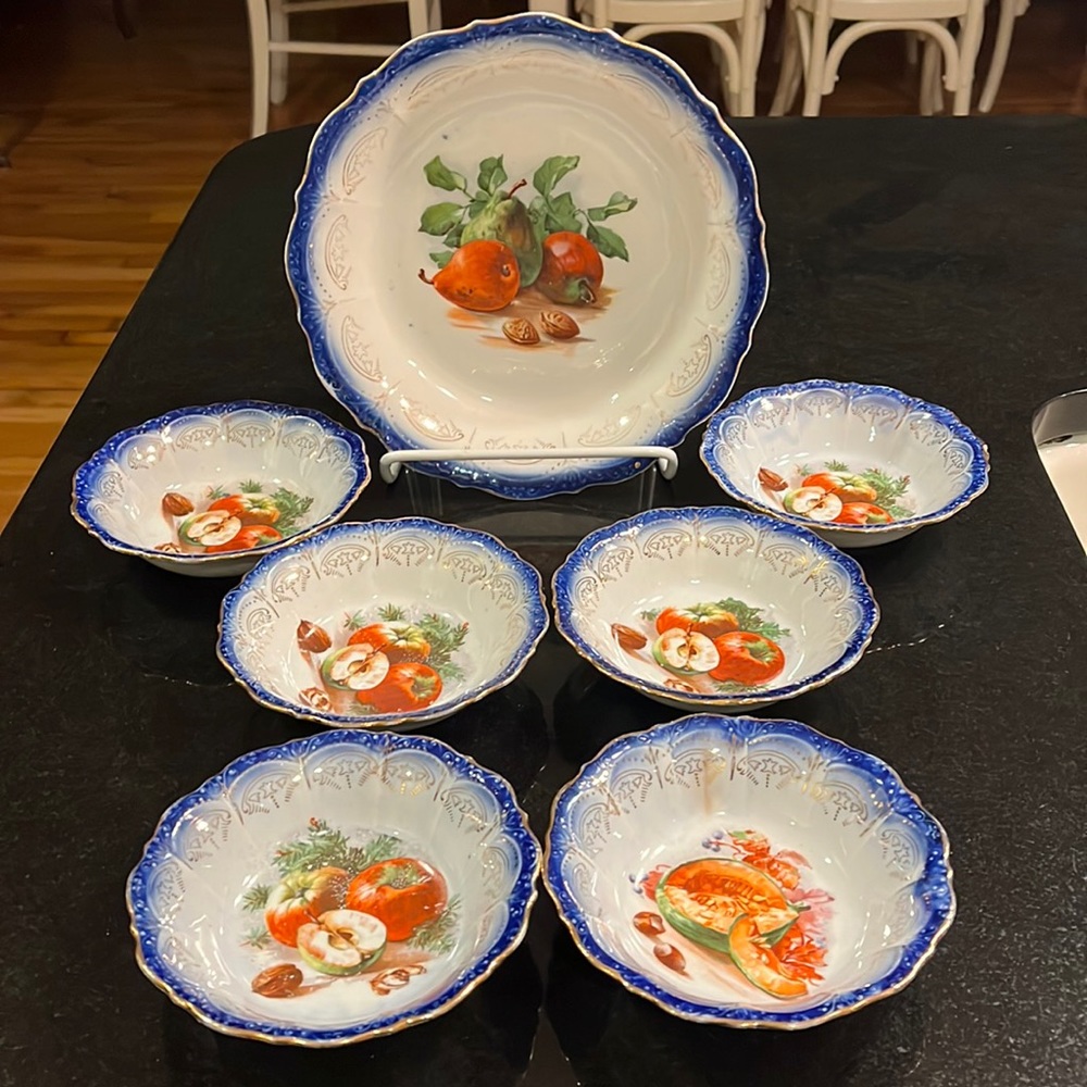 Vintage Flow Blue Bowl with 6 matching fruit bowls.  Gold trim and fruit motif.